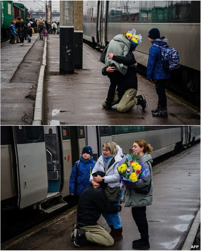 On February 26, 2023, in the midst of Russia's invasion of Ukraine, a Ukrainian man kneels to welcome his family as they arrive from Kyiv at the railway station in Kramatorsk, Ukraine. As a result of Russia's attacks on the capital, it appears that the man was reunited with his family after a long time due to getting separated amid the Russia-Ukraine war