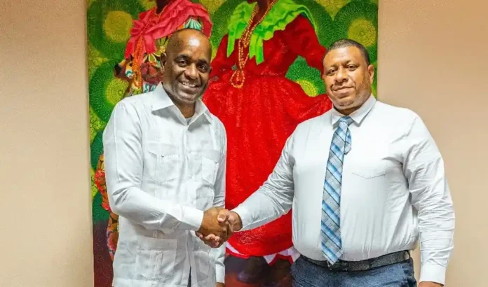 PM Skerrit discusses ideas with new DOMLEC General Manager Dwayne Cenac. Image Credit: Facebook, Roosevelt Skerrit