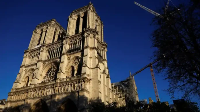 Crowds gather near Notre Dame Cathedral in central Paris, on July 14, 2024