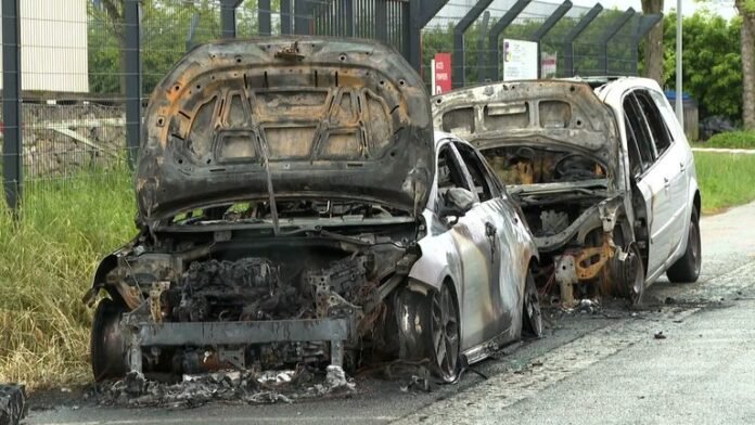 Police discovered a fuel canister on-site, and CCTV footage showed two individuals setting the vehicles ablaze