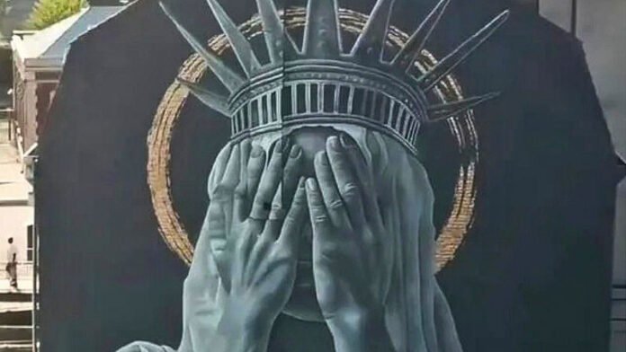 The mural in Roubaix shows the Statue of Liberty covering her eyes in silent protest against US immigration policies