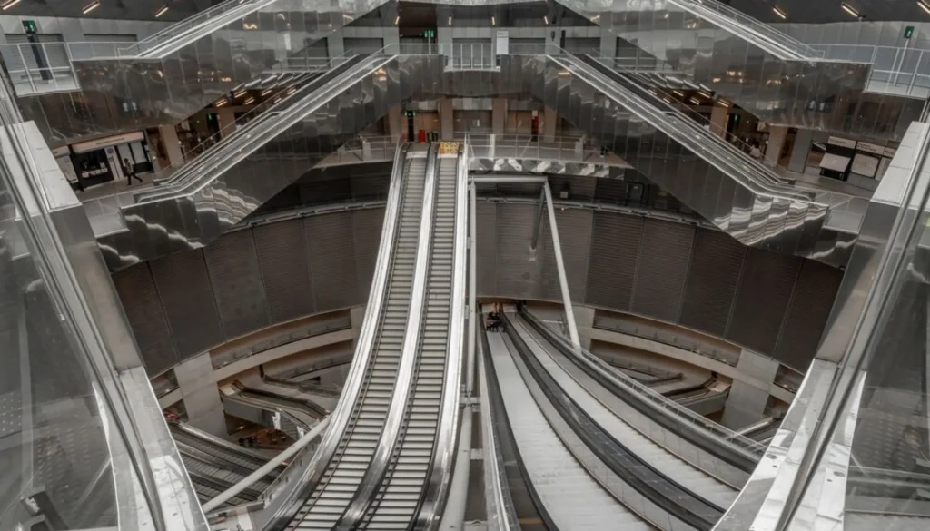 Natural light floods the Villejuif-Gustave Roussy station, revealing stainless-steel surfaces and monumental depth at Paris’s award-winning Line 14 hub
