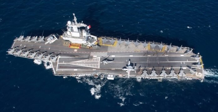 President Macron addresses French troops at an Abu Dhabi base, announcing approval for France’s next-generation aircraft carrier programme this week