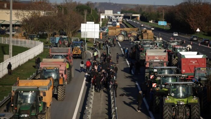 Tractors block a major road near Lyon as farmers protest cattle disease measures and government agricultural policies