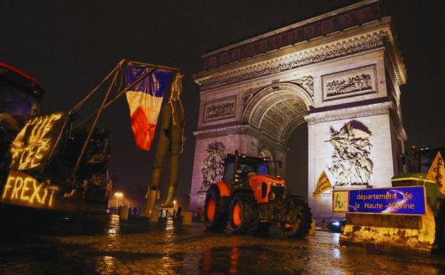French farmers drive tractors near the Arc de Triomphe during protests against EU trade policies in central Paris French farmers drive tractors near the Arc de Triomphe during protests against EU trade policies in central Paris